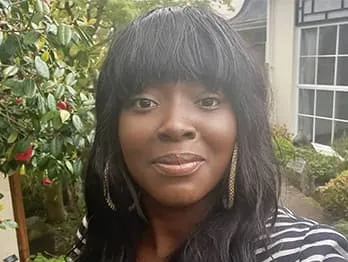 A photo of Ebony Walters, Managing DIrector of Rosetinted Financial Services CIC.